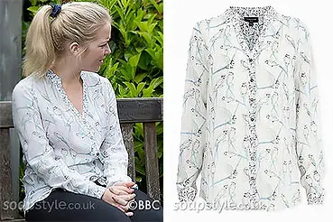Abi Branning wearing a bird blouse on EastEnders